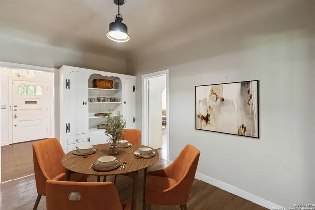 a dining room with furniture and window