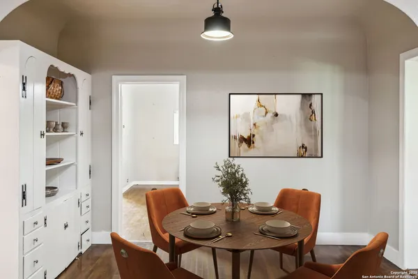 a view of a dining room with furniture and wooden floor