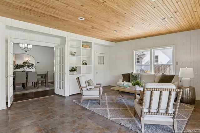 a living room with furniture and a table
