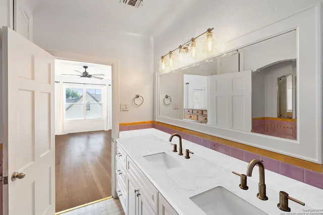 a bathroom with a sink and a mirror