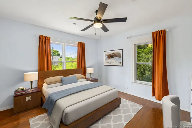 a bedroom with a bed and a window