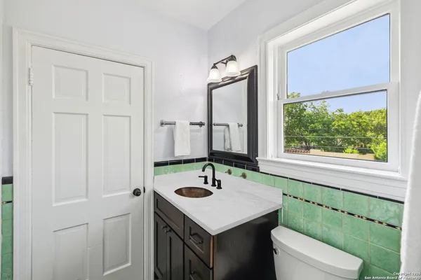 a bathroom with a sink and a toilet