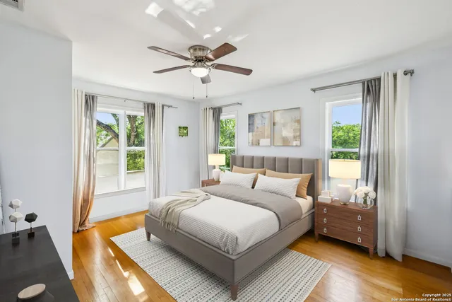 a bedroom with a large bed and a window