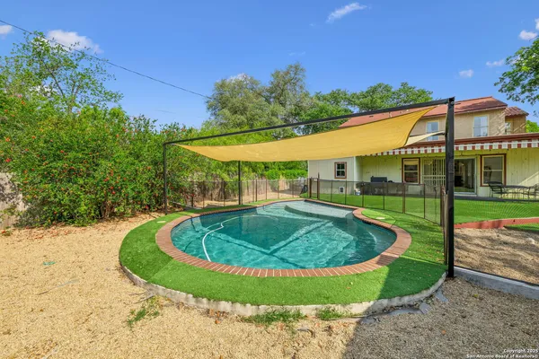 a view of outdoor space yard swimming pool and outdoor seating