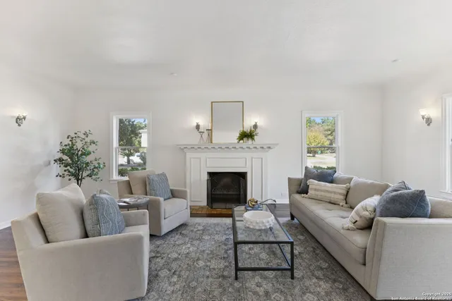 a living room with furniture and a fireplace