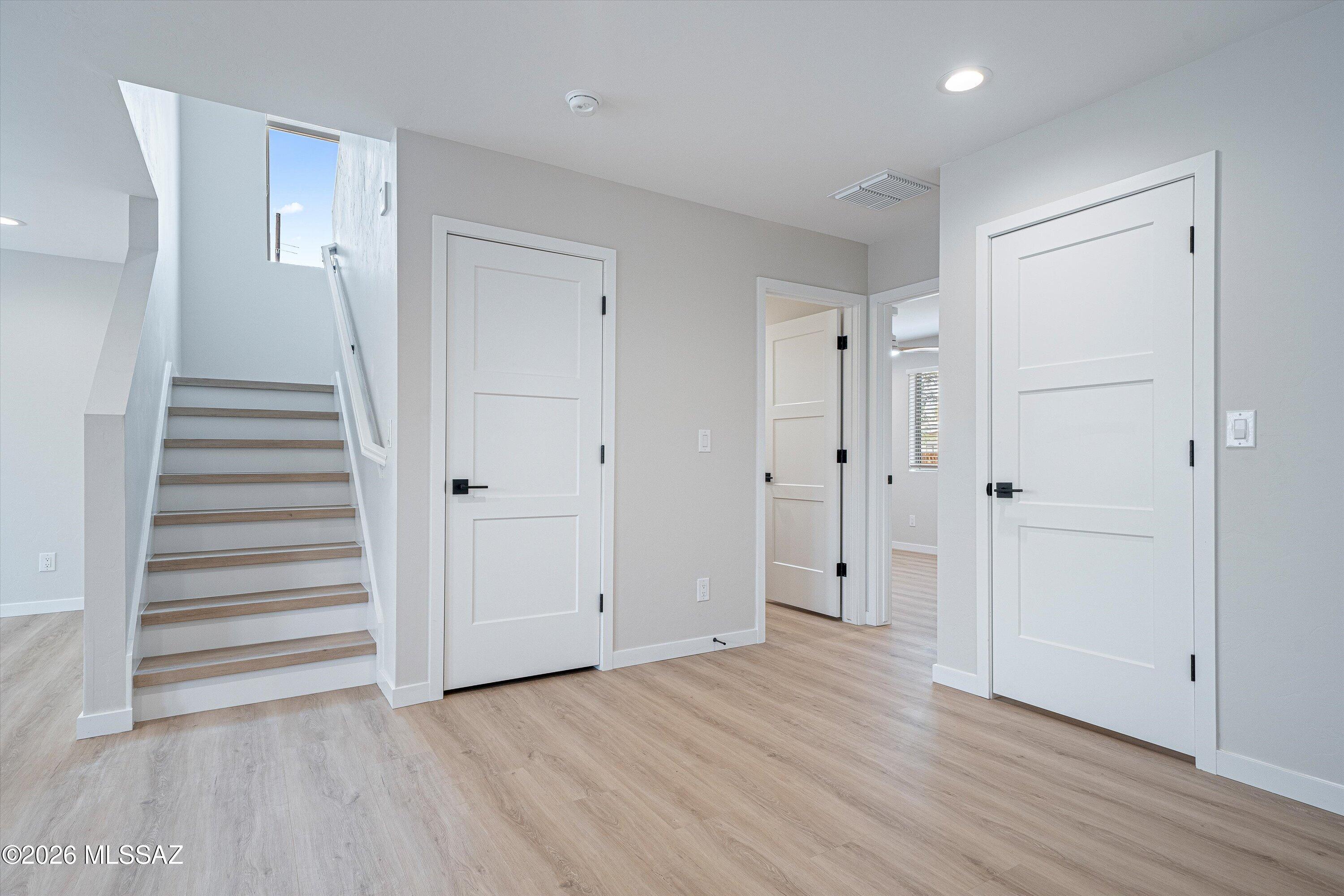 739 North Queen Avenue, Unit 2 Tucson, AZ 85705 - Photo 19 of 28 a view of a hallway with wooden floor and entryway