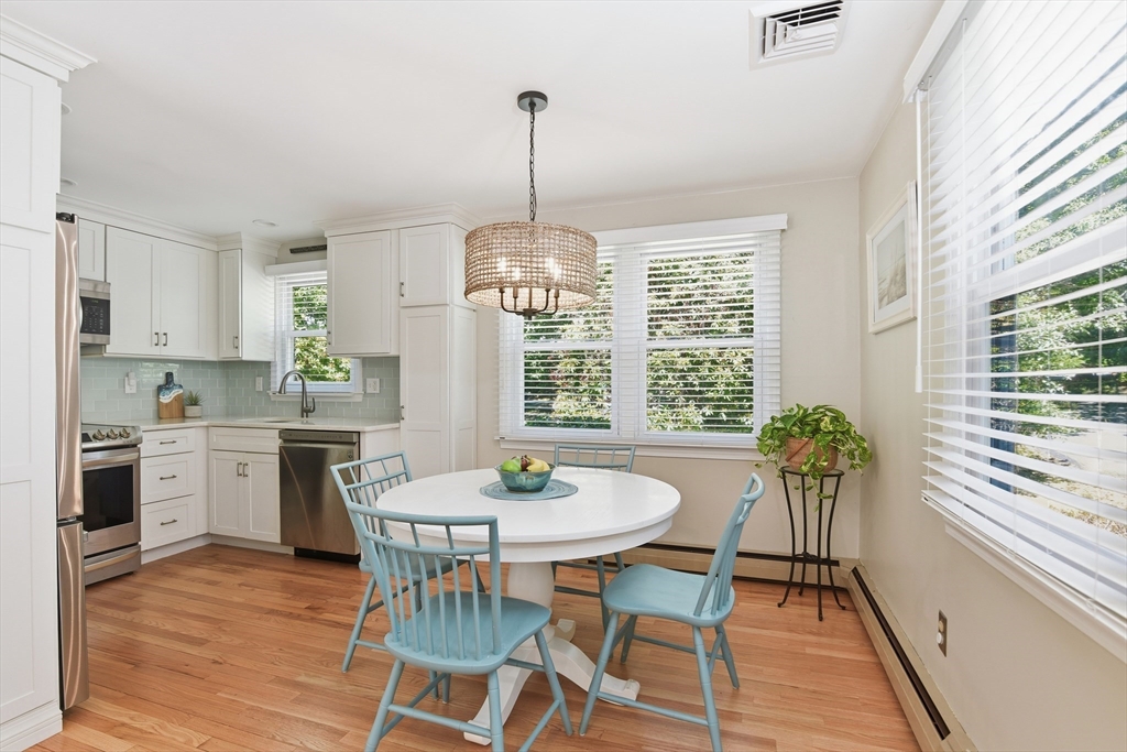 8 Emerald Way Sandwich, MA 02644 - Photo 6 of 36 a view of a dining room with furniture window and wooden floor