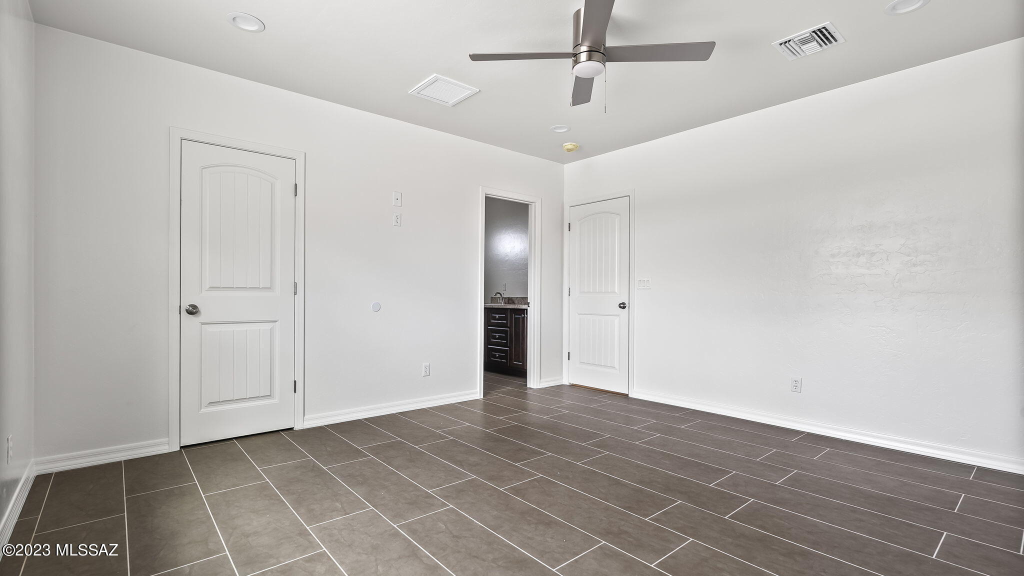 1019 Paseo Guebabi Rio Rico, AZ 85648 - Photo 23 of 25 wooden floor in an empty room