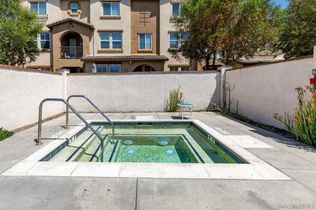 a view of a backyard with sitting area