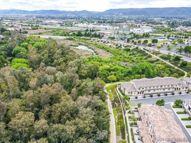 an aerial view of residential houses and outdoor space