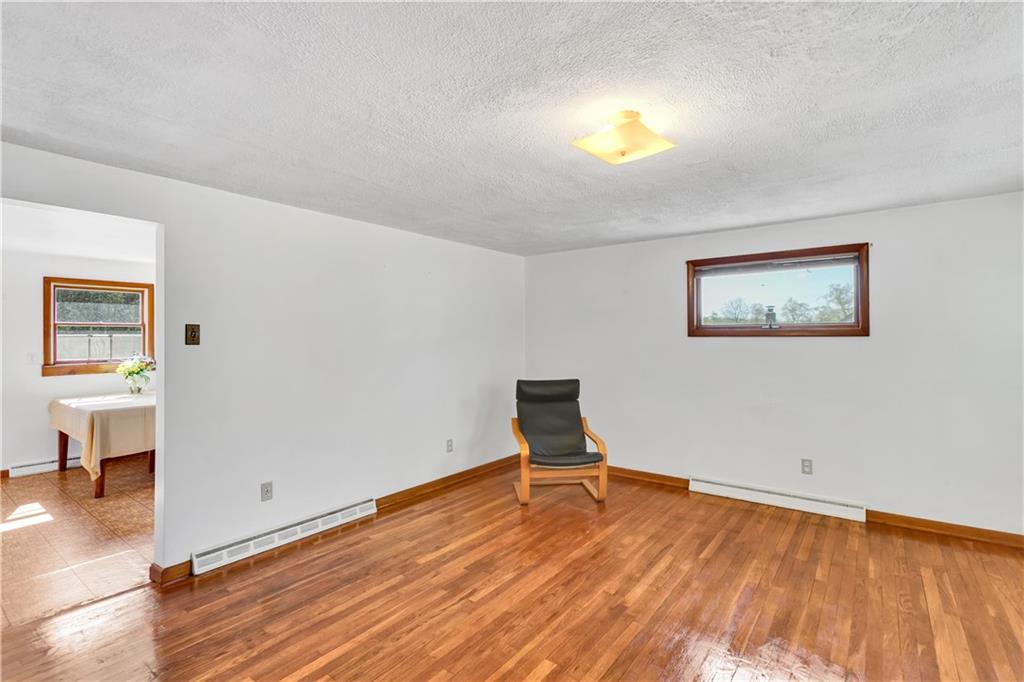 125 Mary Reed Road Baden, PA 15005 - Photo 5 of 31 a view of a room with wooden floor and a window