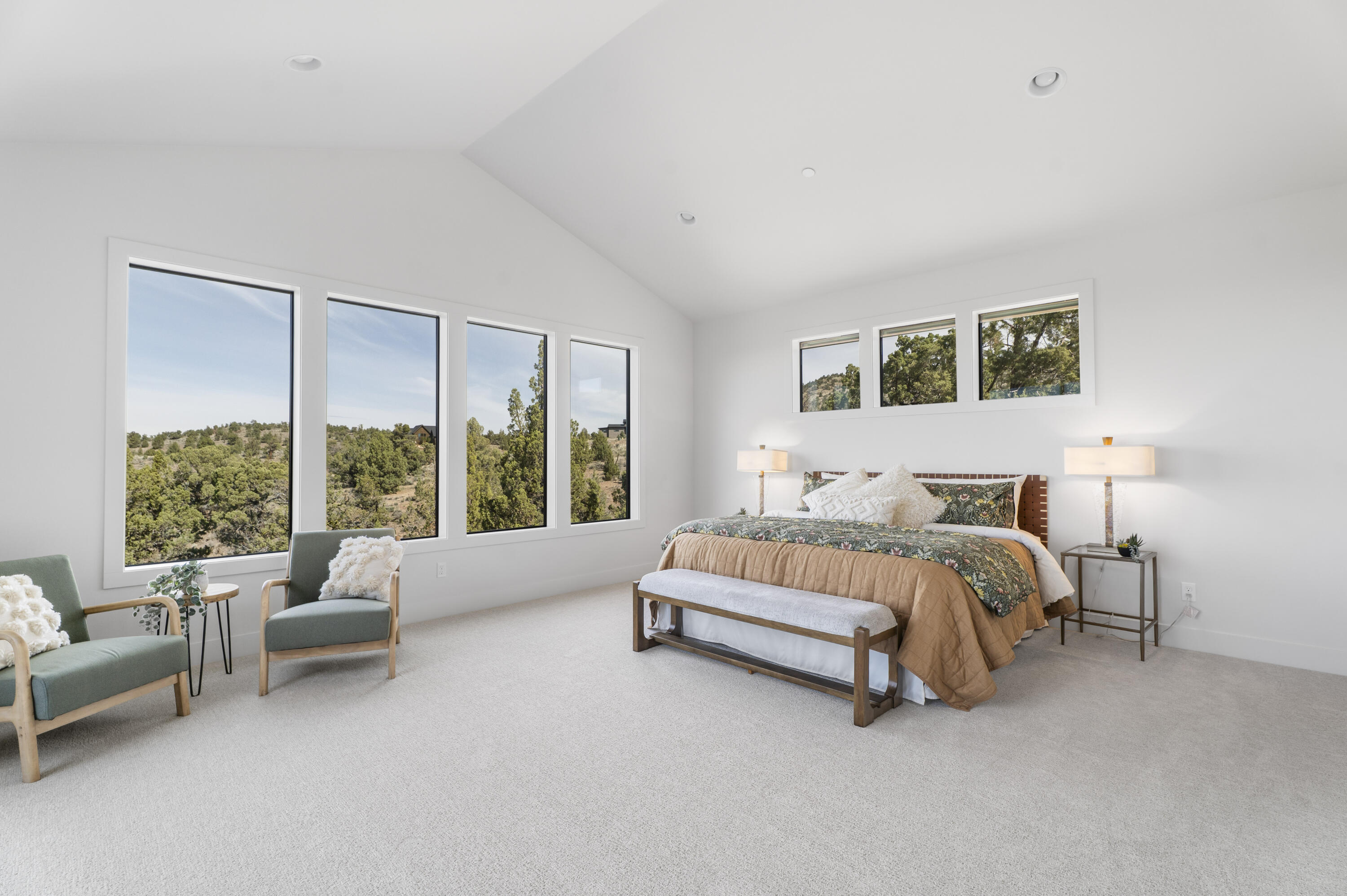 16883 Southwest Paragon Court Powell Butte, OR 97753 - Photo 14 of 42 Grand primary suite with more of the home's signature windows and vaulted ceilings