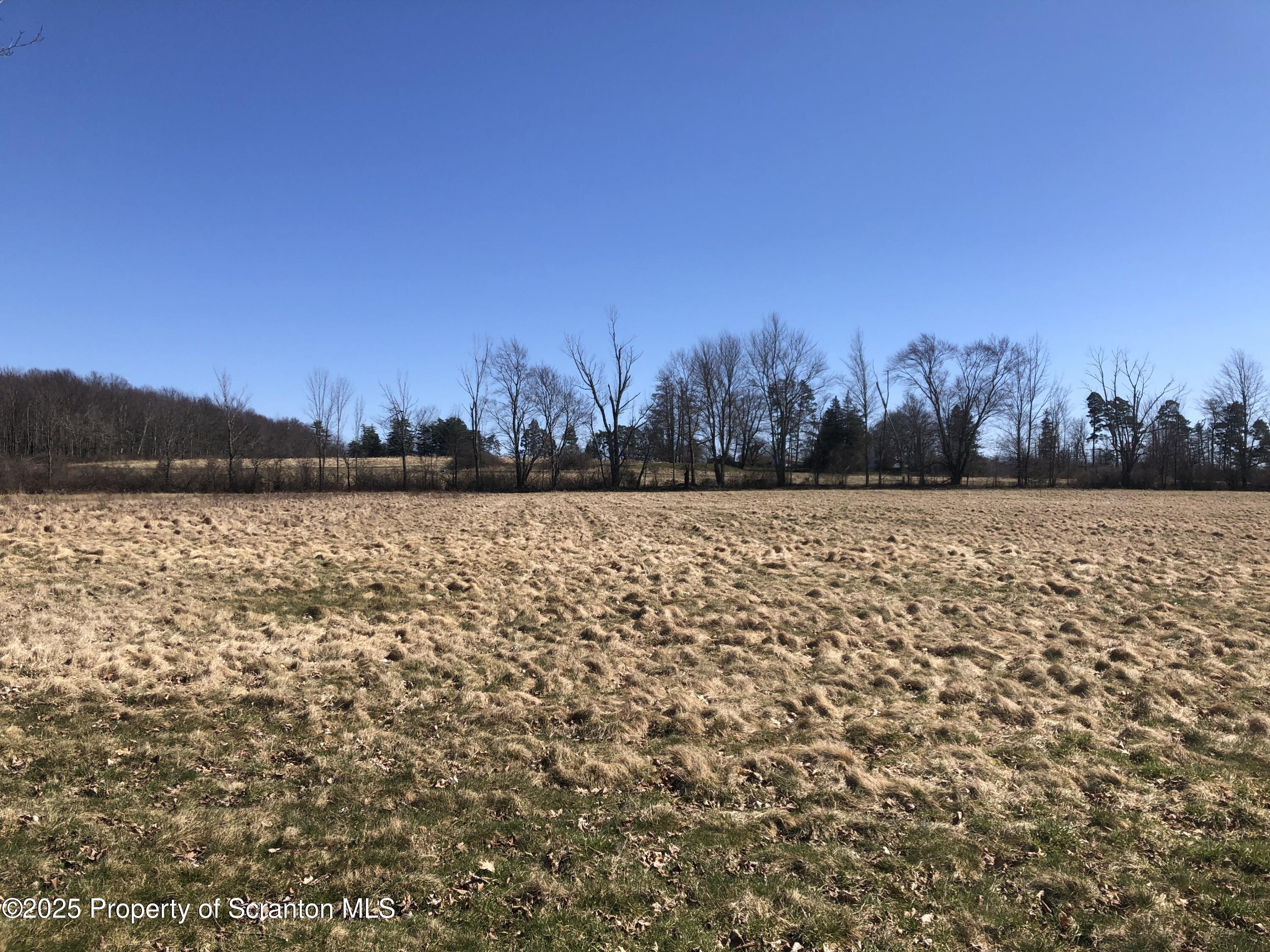 624 Lily Lake Road Dalton, PA 18414 - Photo 2 of 2 a view of a lake with houses in the background