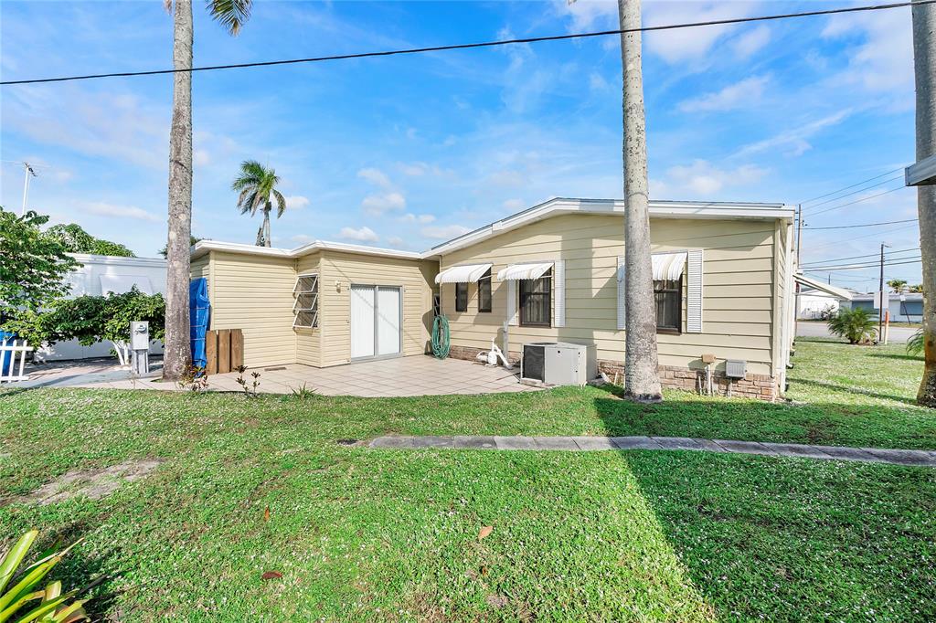 8600 Southwest 16th Place Davie, FL 33324 - Photo 14 of 20 a front view of a house with a yard