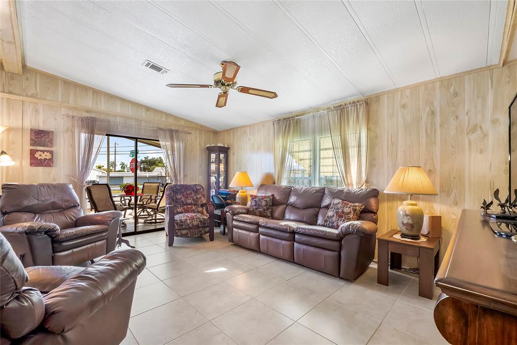 8600 Southwest 16th Place Davie, FL 33324 - Photo 4 of 20 a living room with furniture a ceiling fan and a window