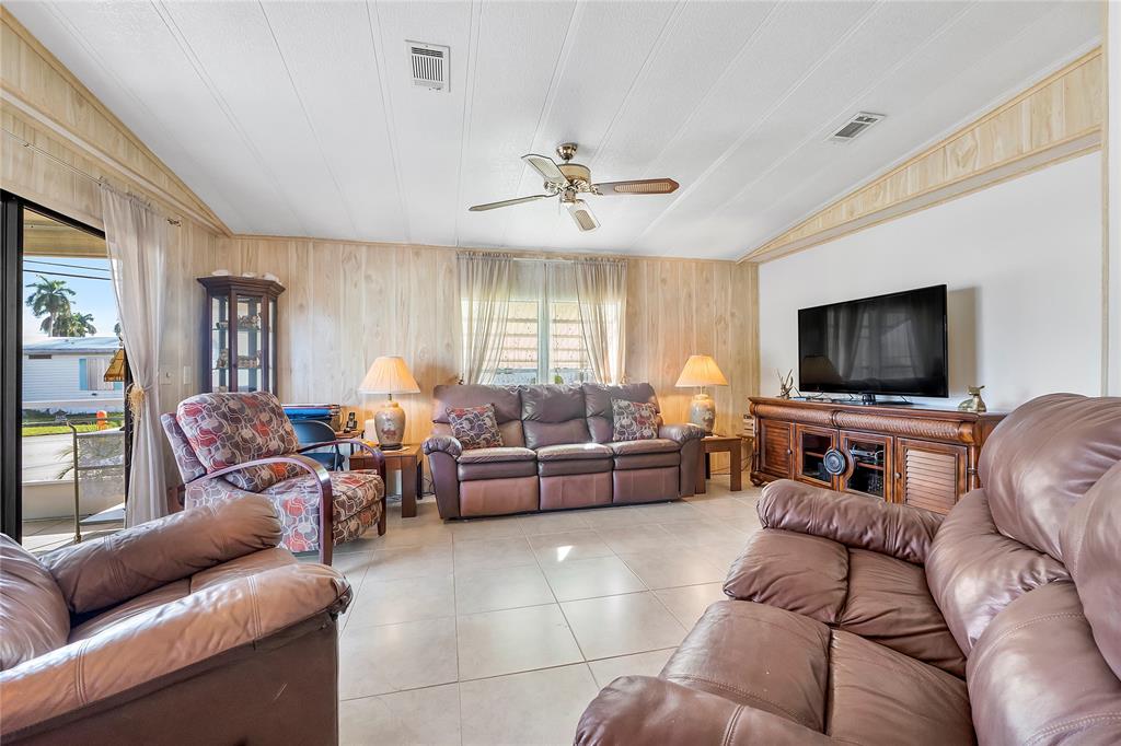 8600 Southwest 16th Place Davie, FL 33324 - Photo 5 of 20 a living room with furniture and a flat screen tv