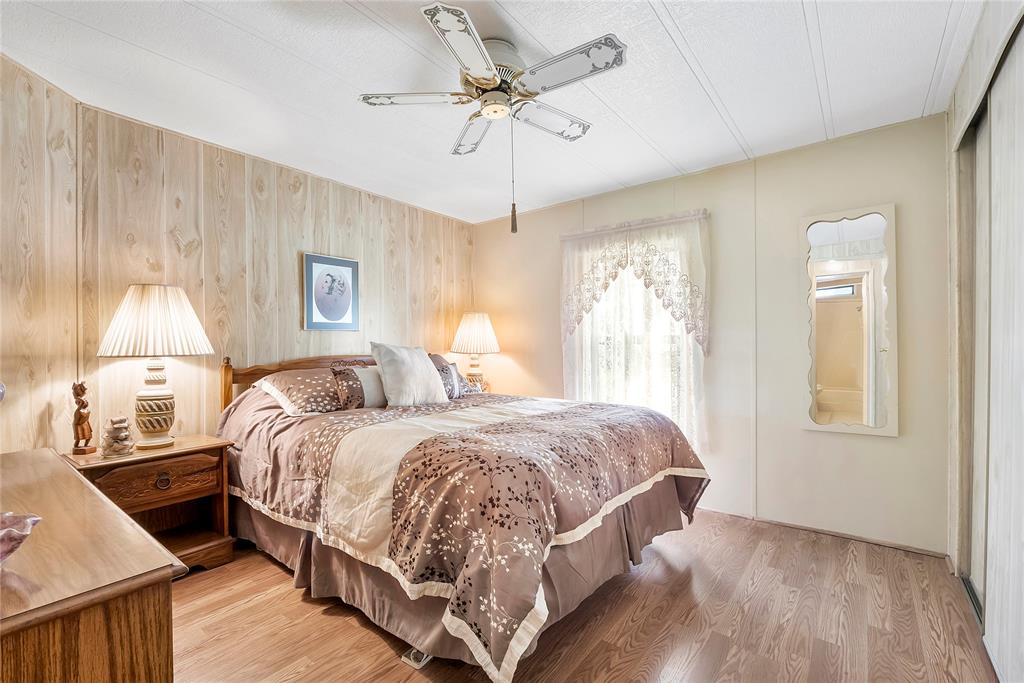 8600 Southwest 16th Place Davie, FL 33324 - Photo 7 of 20 a bedroom with a bed and a chandelier