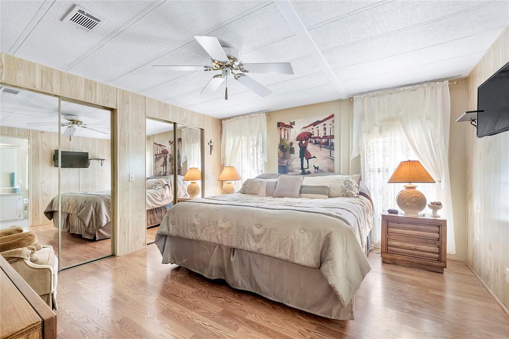8600 Southwest 16th Place Davie, FL 33324 - Photo 8 of 20 a spacious bedroom with a bed and wooden floor