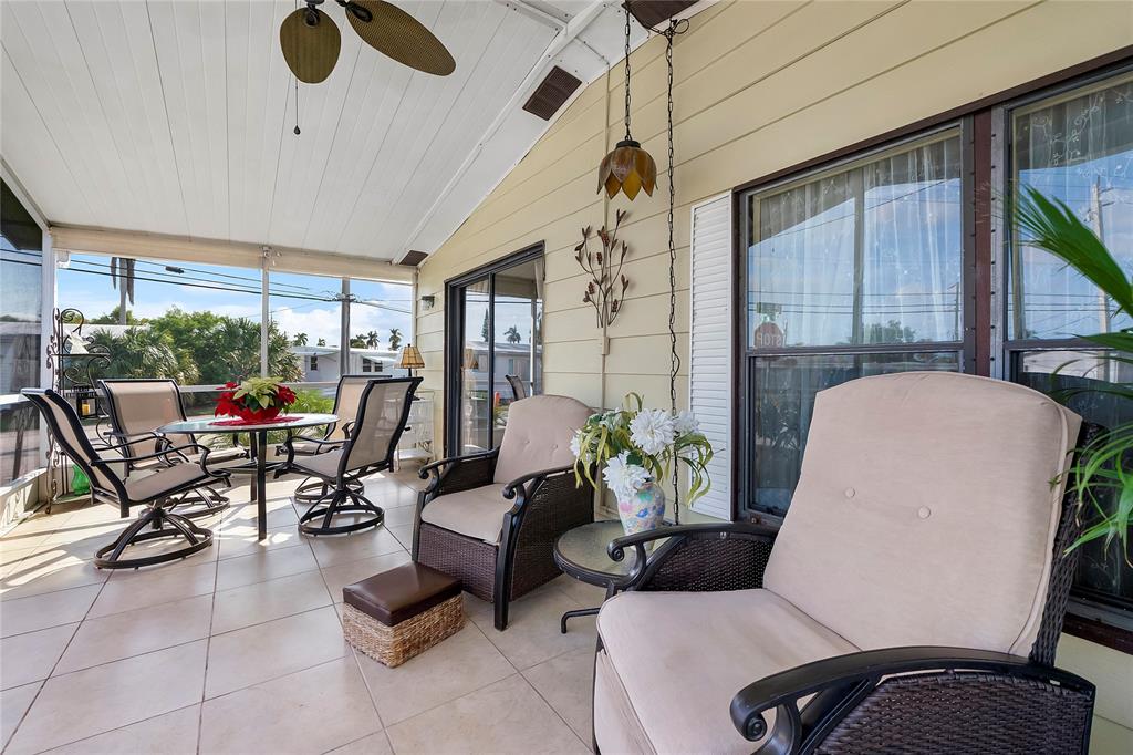8600 Southwest 16th Place Davie, FL 33324 - Photo 9 of 20 a living room with furniture a floor to ceiling window and potted plant