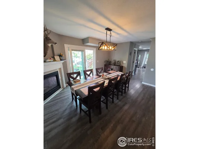 a view of a dining room with furniture and window