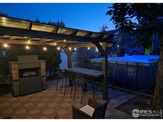 a view of a chairs and table in patio