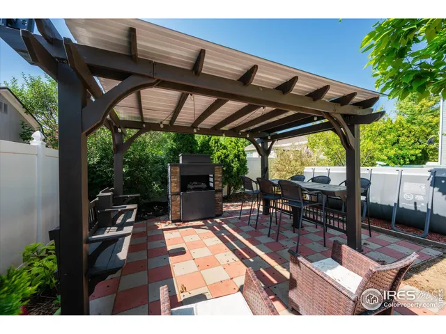 a view of a chairs and table in the patio
