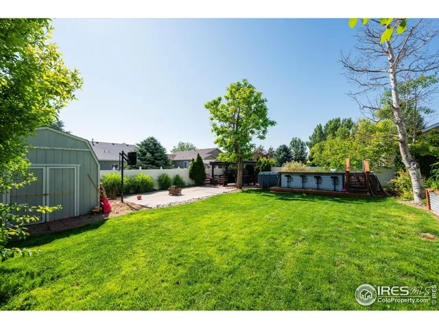 a view of backyard with a garden and entertaining space