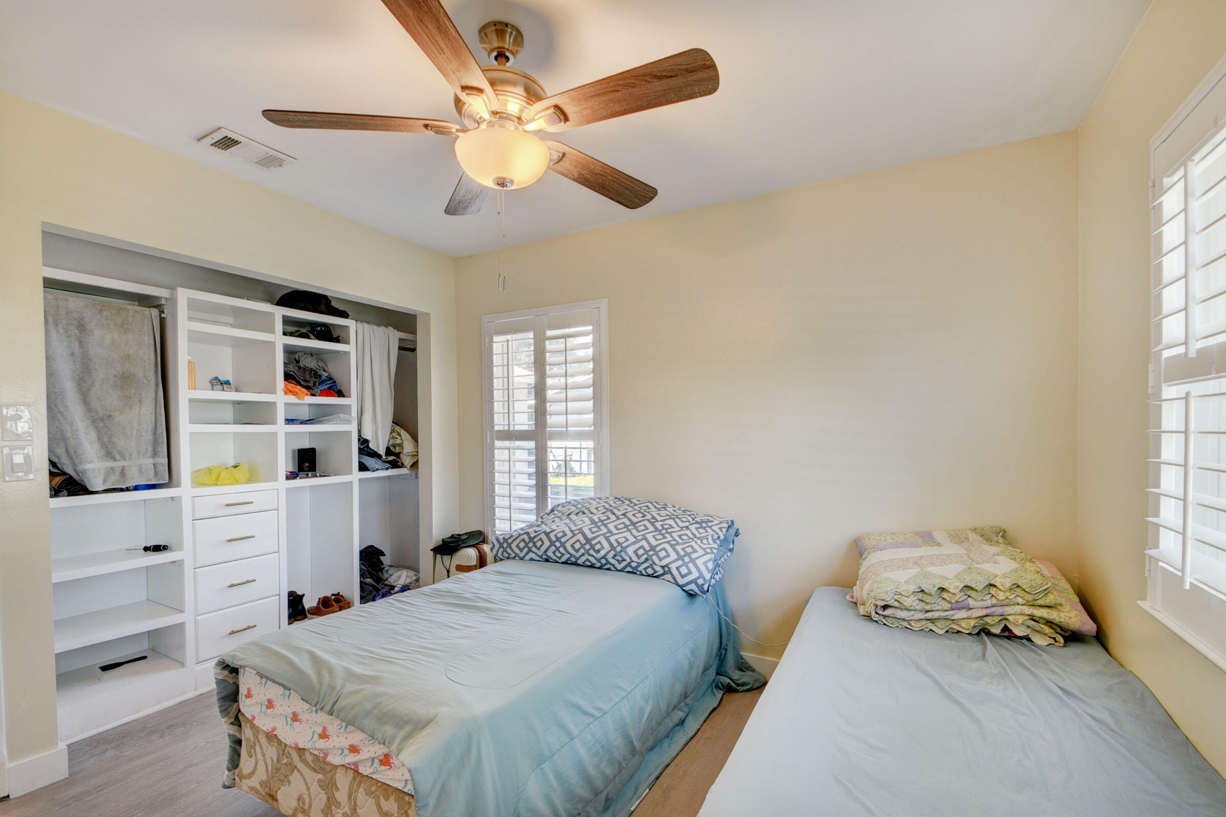 7258 Pine Manor Drive Lake Worth, FL 33467 - Photo 21 of 39 a bedroom with a bed and a window