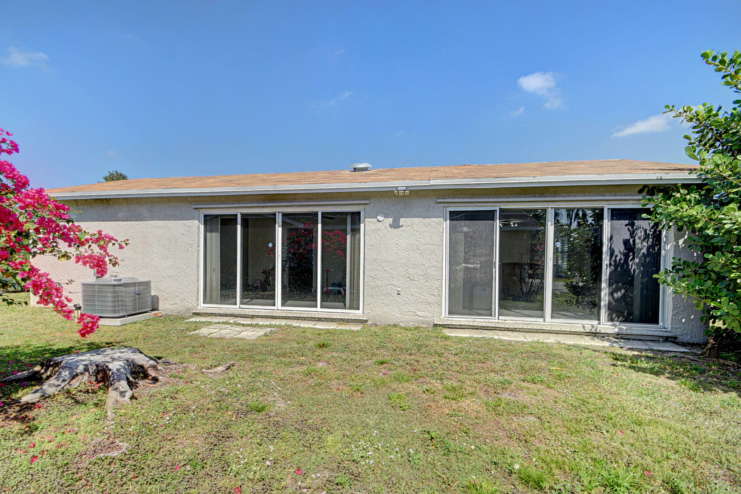 7258 Pine Manor Drive Lake Worth, FL 33467 - Photo 26 of 39 front view of a house with an outdoor space