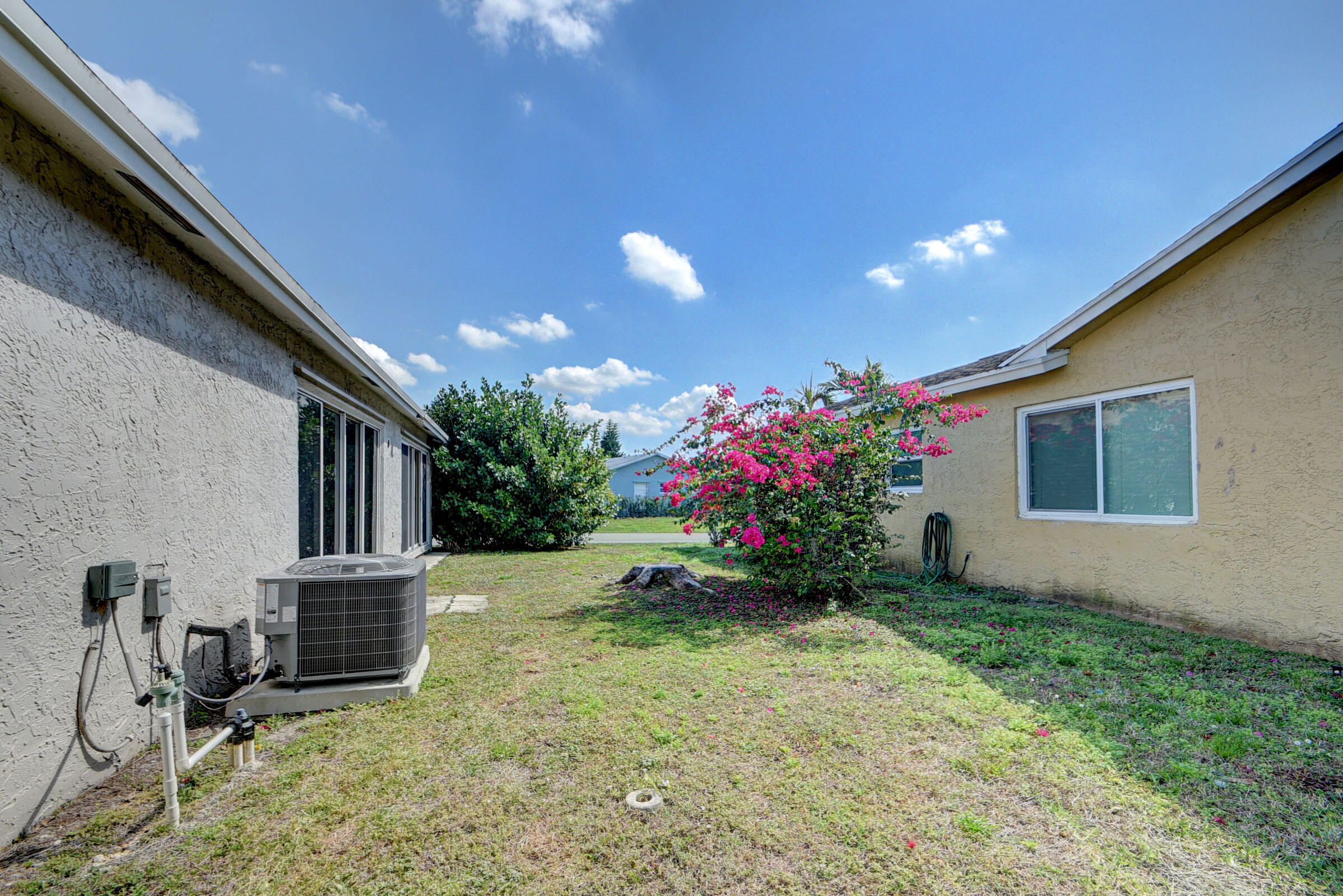 7258 Pine Manor Drive Lake Worth, FL 33467 - Photo 28 of 39 a view of a house with backyard and garden