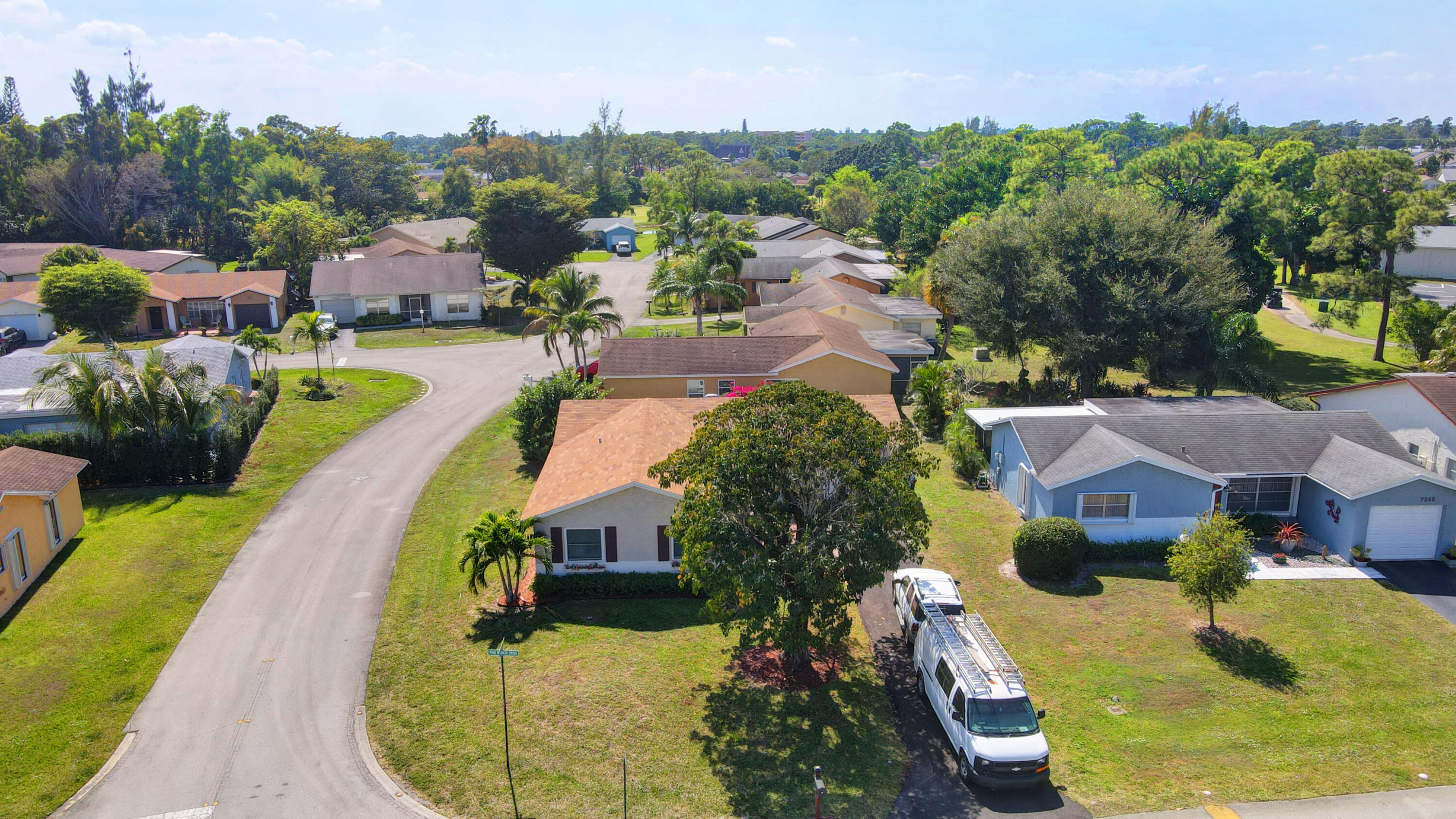 7258 Pine Manor Drive Lake Worth, FL 33467 - Photo 32 of 39 an aerial view of a house with a swimming pool