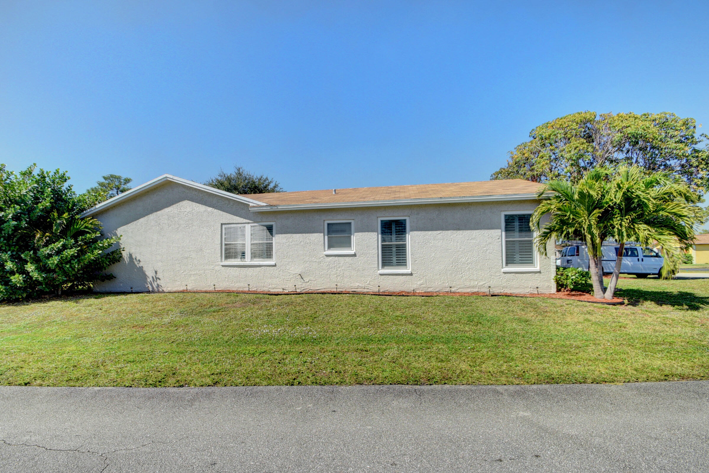 7258 Pine Manor Drive Lake Worth, FL 33467 - Photo 4 of 39 a house that has a lot of plants in it