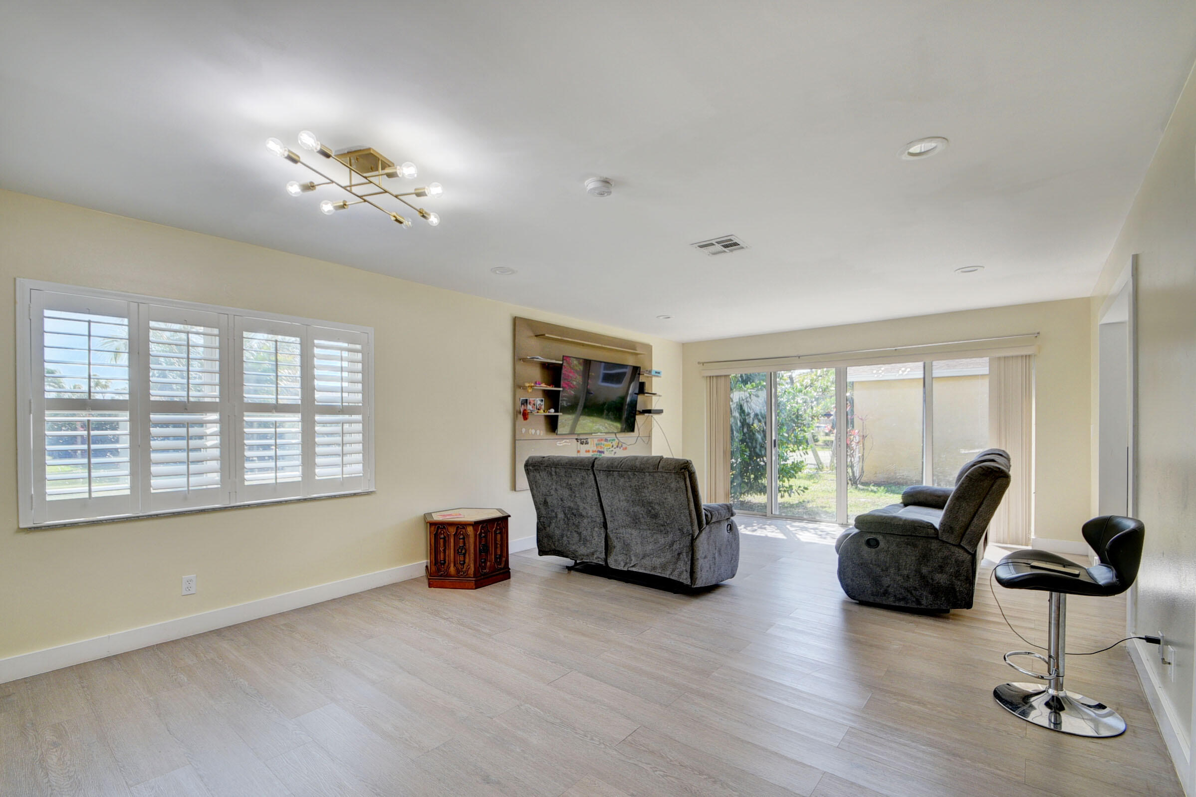 7258 Pine Manor Drive Lake Worth, FL 33467 - Photo 6 of 39 a living room with furniture and wooden floor