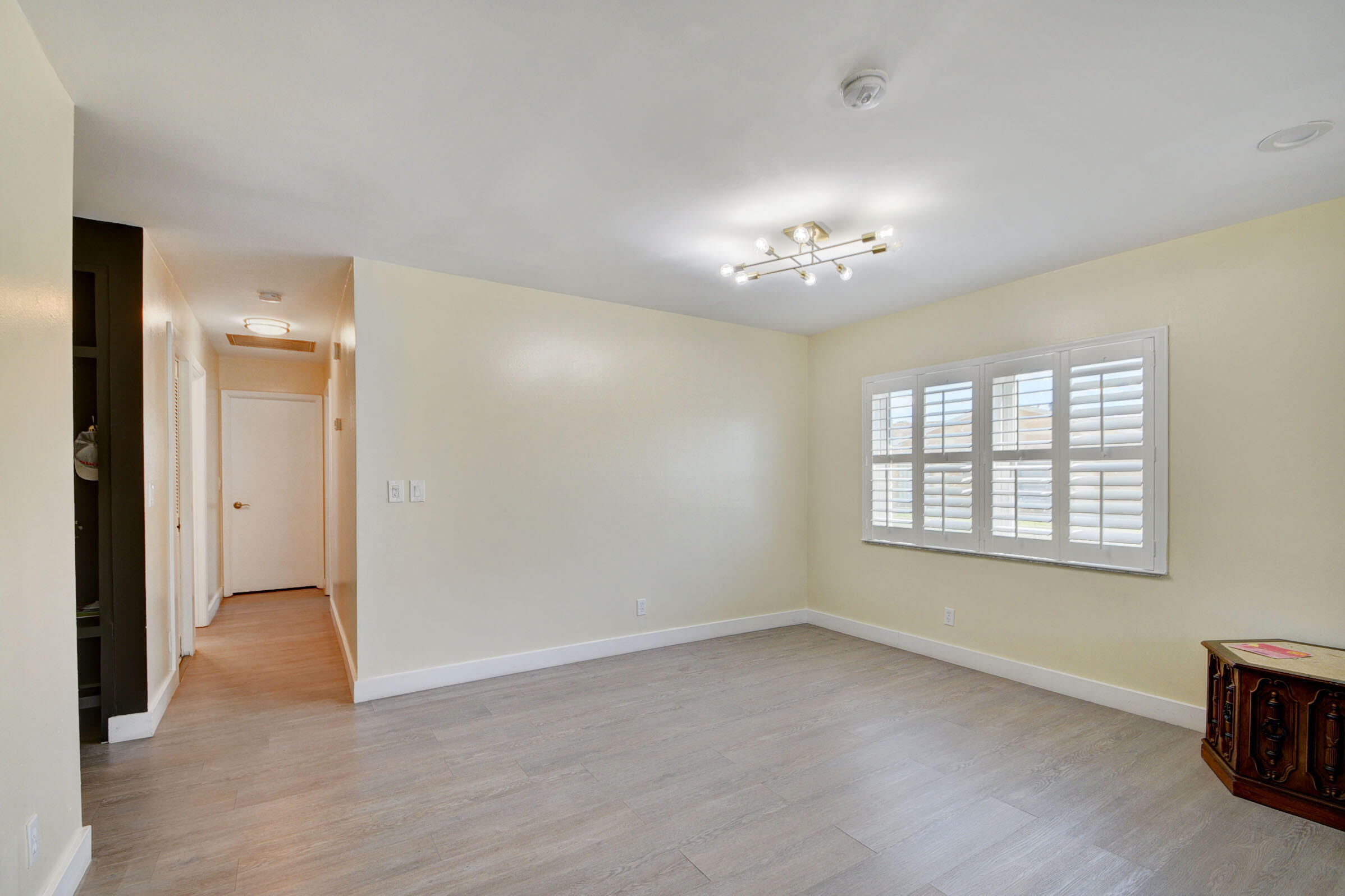 7258 Pine Manor Drive Lake Worth, FL 33467 - Photo 7 of 39 a view of an empty room with a window