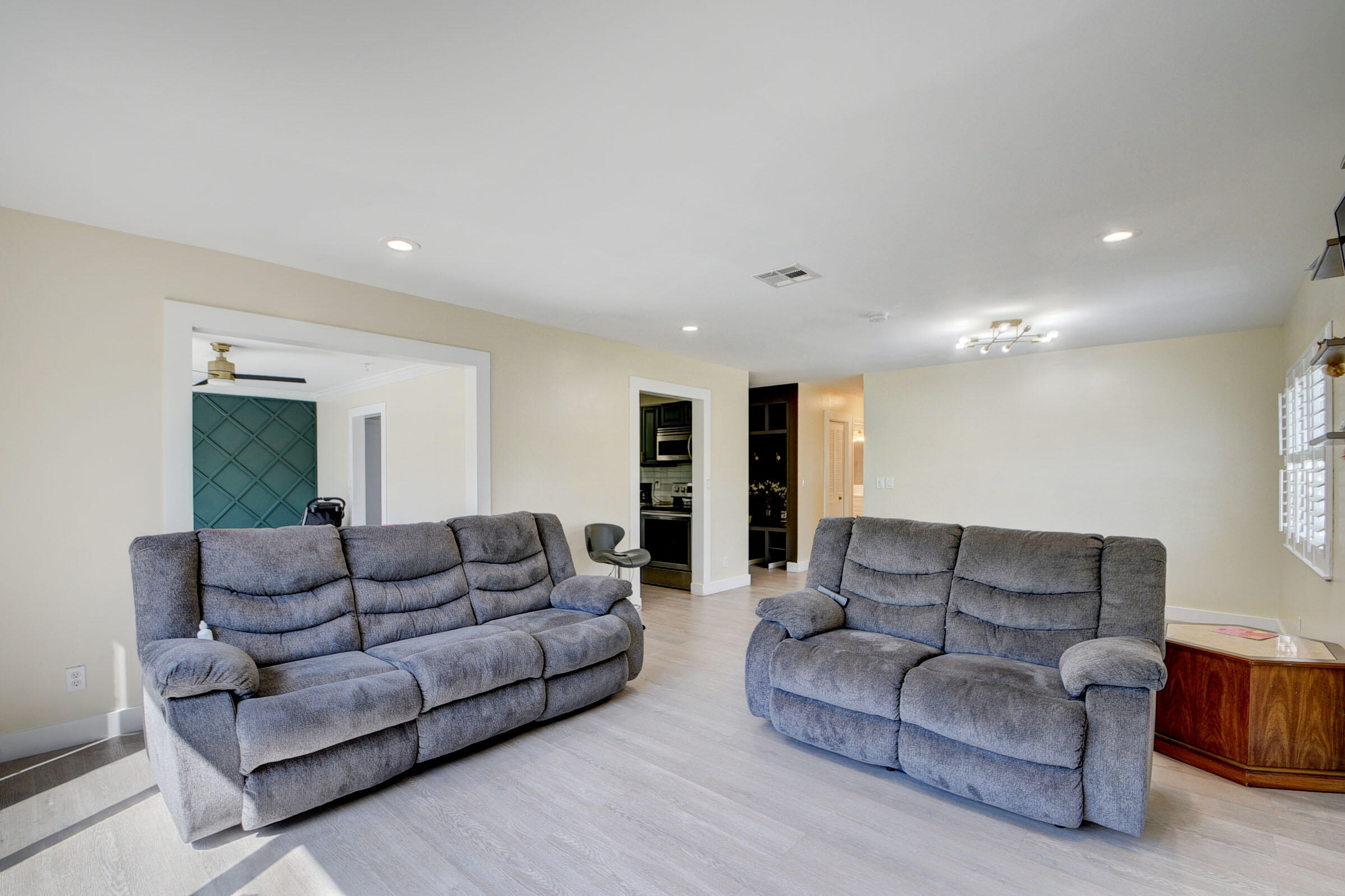 7258 Pine Manor Drive Lake Worth, FL 33467 - Photo 9 of 39 a living room with furniture and a couch
