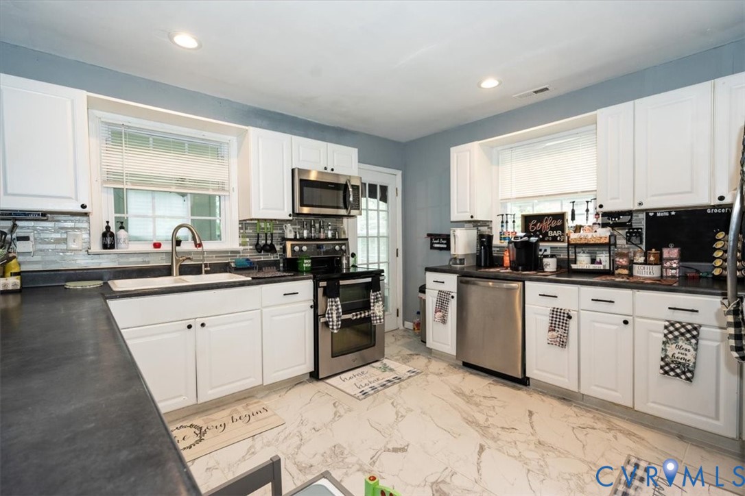 5510 Alberta Road Chesterfield, VA 23832 - Photo 9 of 29 White cabinetry with dark hardware, dark counterto