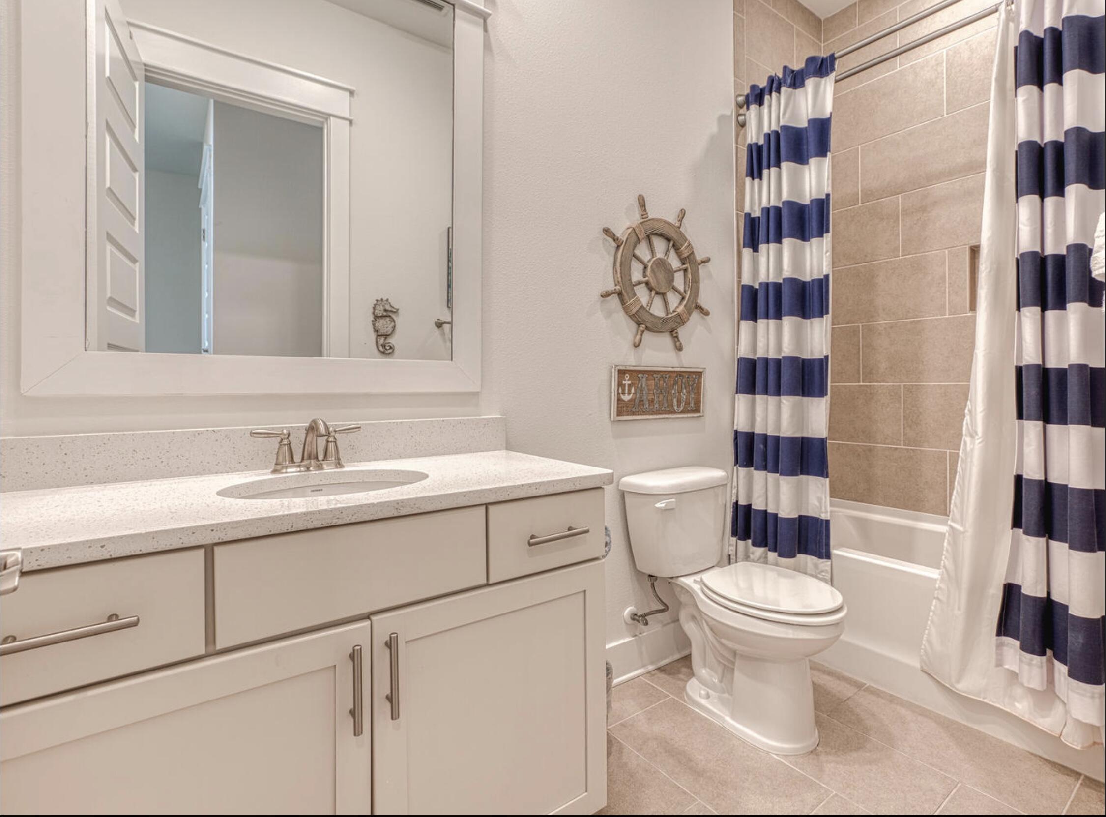 209 Milestone Dr Inlet Beach, Unit B Inlet Beach, FL 32461 - Photo 12 of 39 a bathroom with a sink toilet and shower
