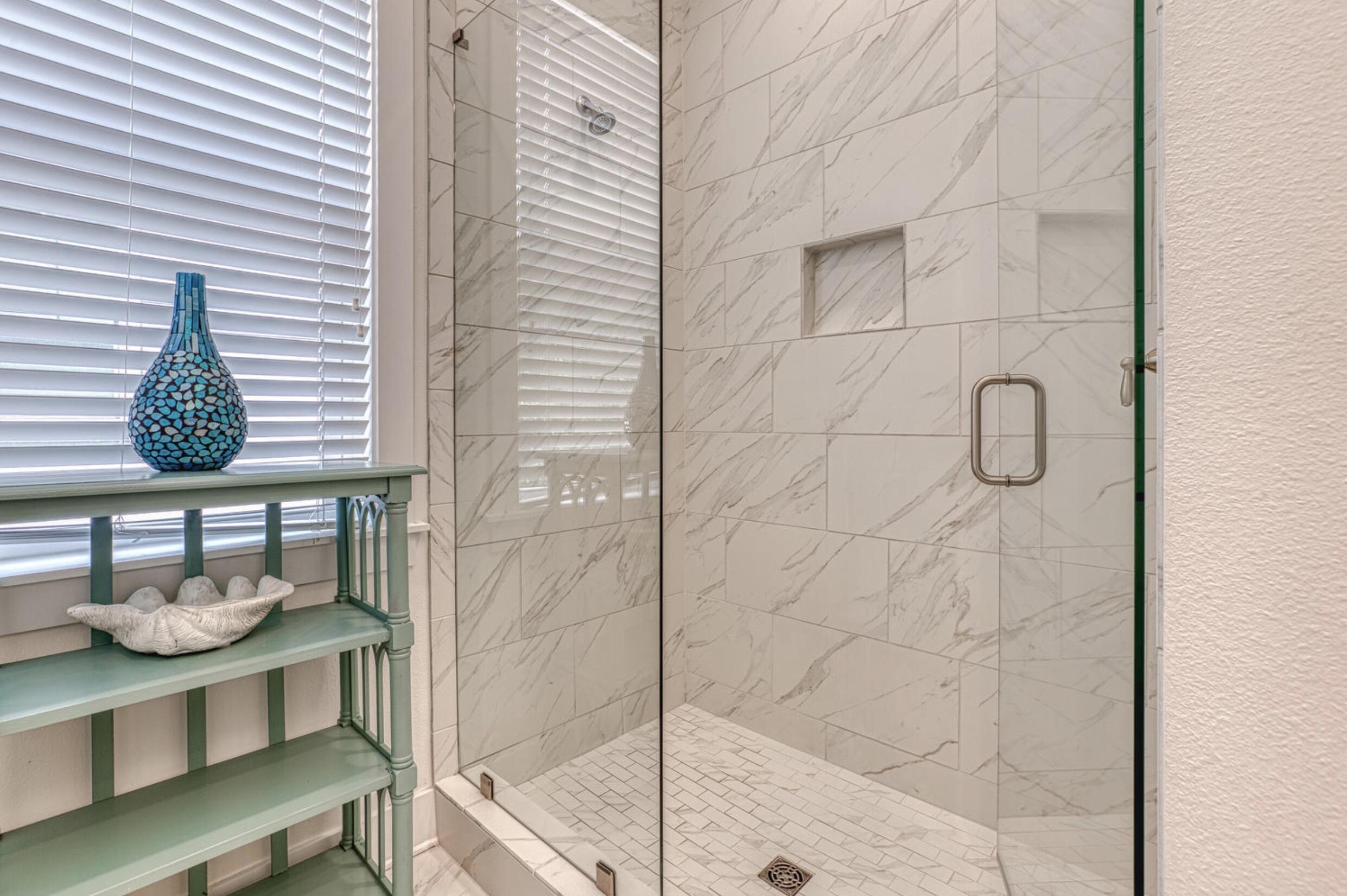 209 Milestone Dr Inlet Beach, Unit B Inlet Beach, FL 32461 - Photo 14 of 39 a bathroom with a granite countertop mirror and shower