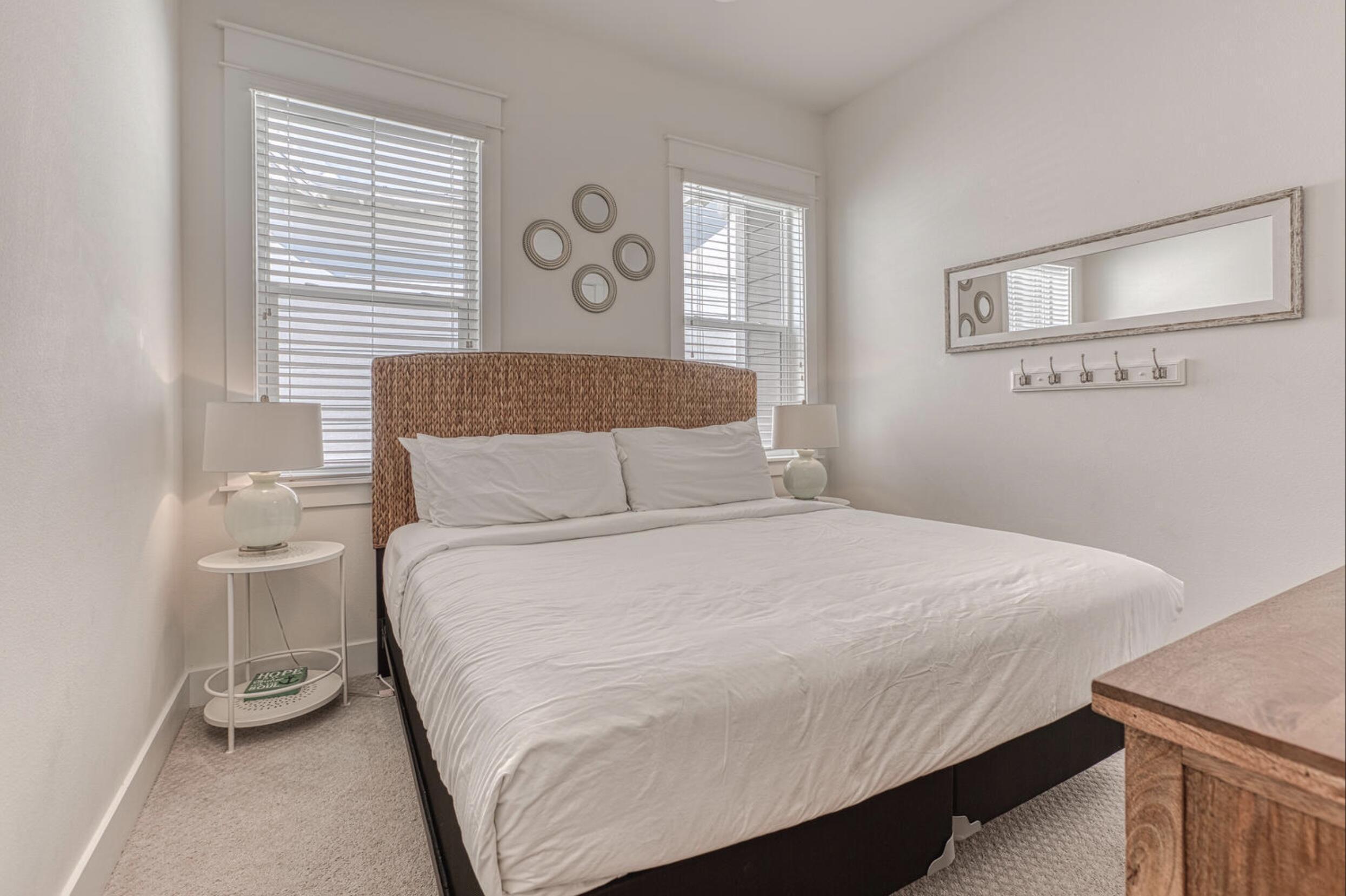 209 Milestone Dr Inlet Beach, Unit B Inlet Beach, FL 32461 - Photo 16 of 39 a bedroom with a bed and a window