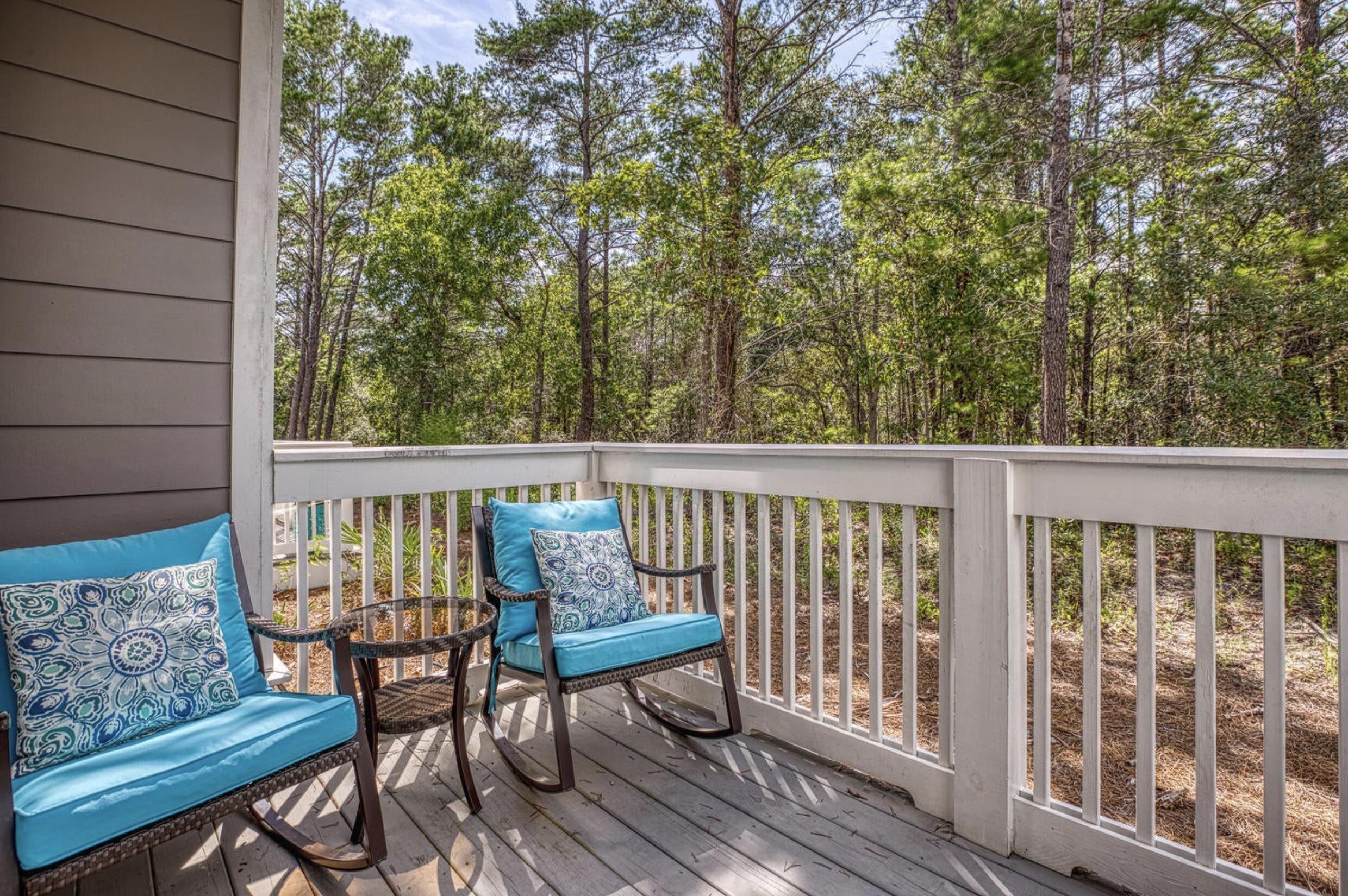 209 Milestone Dr Inlet Beach, Unit B Inlet Beach, FL 32461 - Photo 22 of 39 a view of a chairs in wooden deck