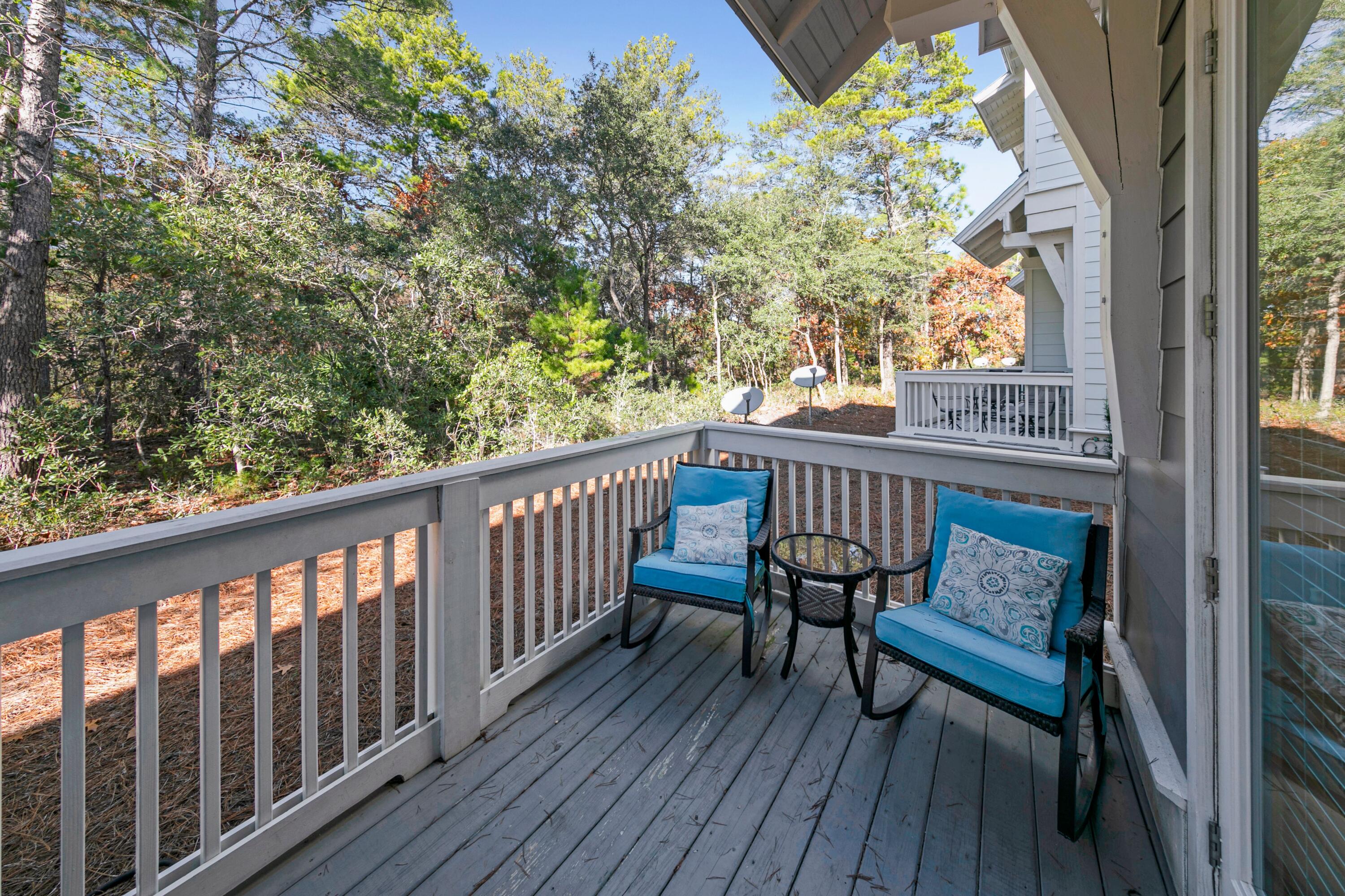 209 Milestone Dr Inlet Beach, Unit B Inlet Beach, FL 32461 - Photo 26 of 39 a view of a two chairs in the balcony