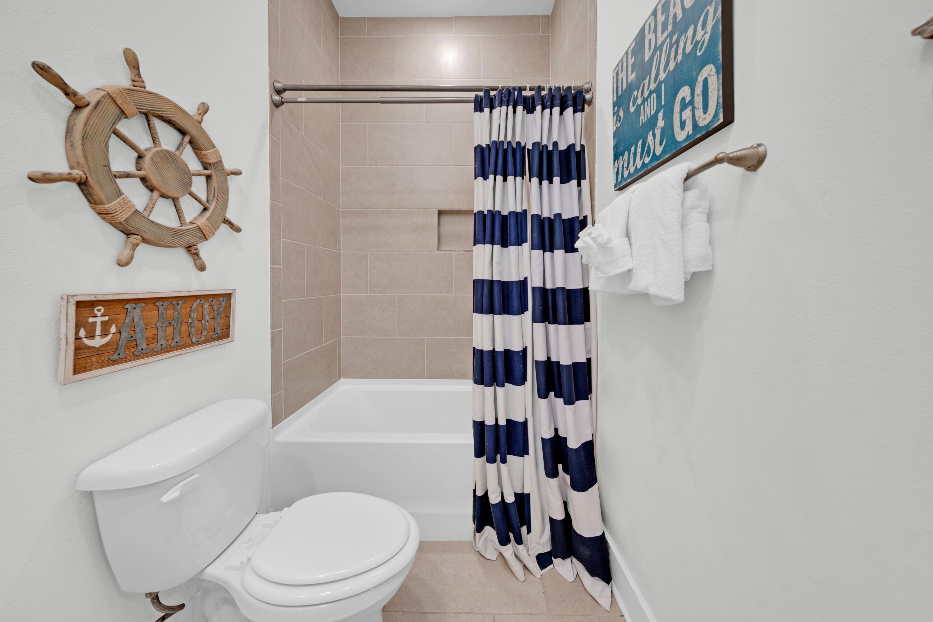 209 Milestone Dr Inlet Beach, Unit B Inlet Beach, FL 32461 - Photo 32 of 39 a bathroom with a toilet and a shower