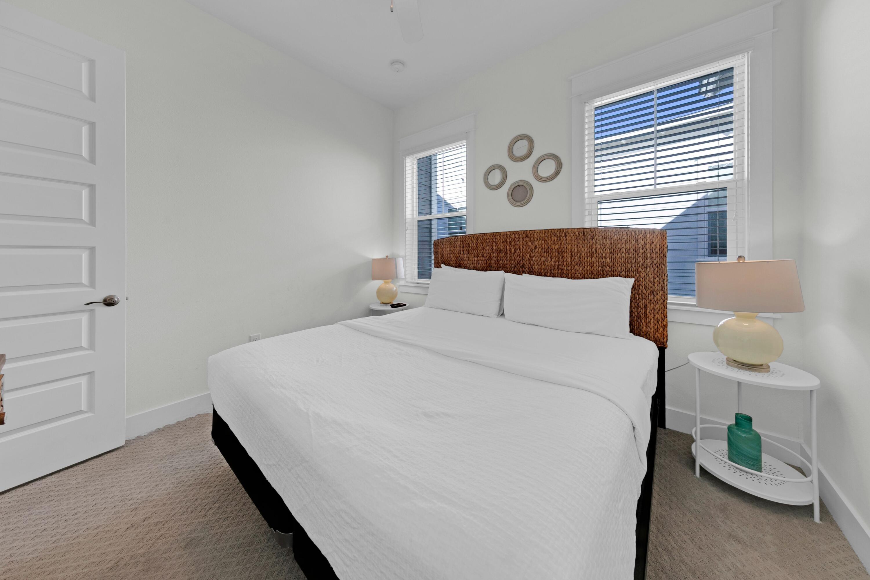 209 Milestone Dr Inlet Beach, Unit B Inlet Beach, FL 32461 - Photo 35 of 39 a bedroom with a bed and a window