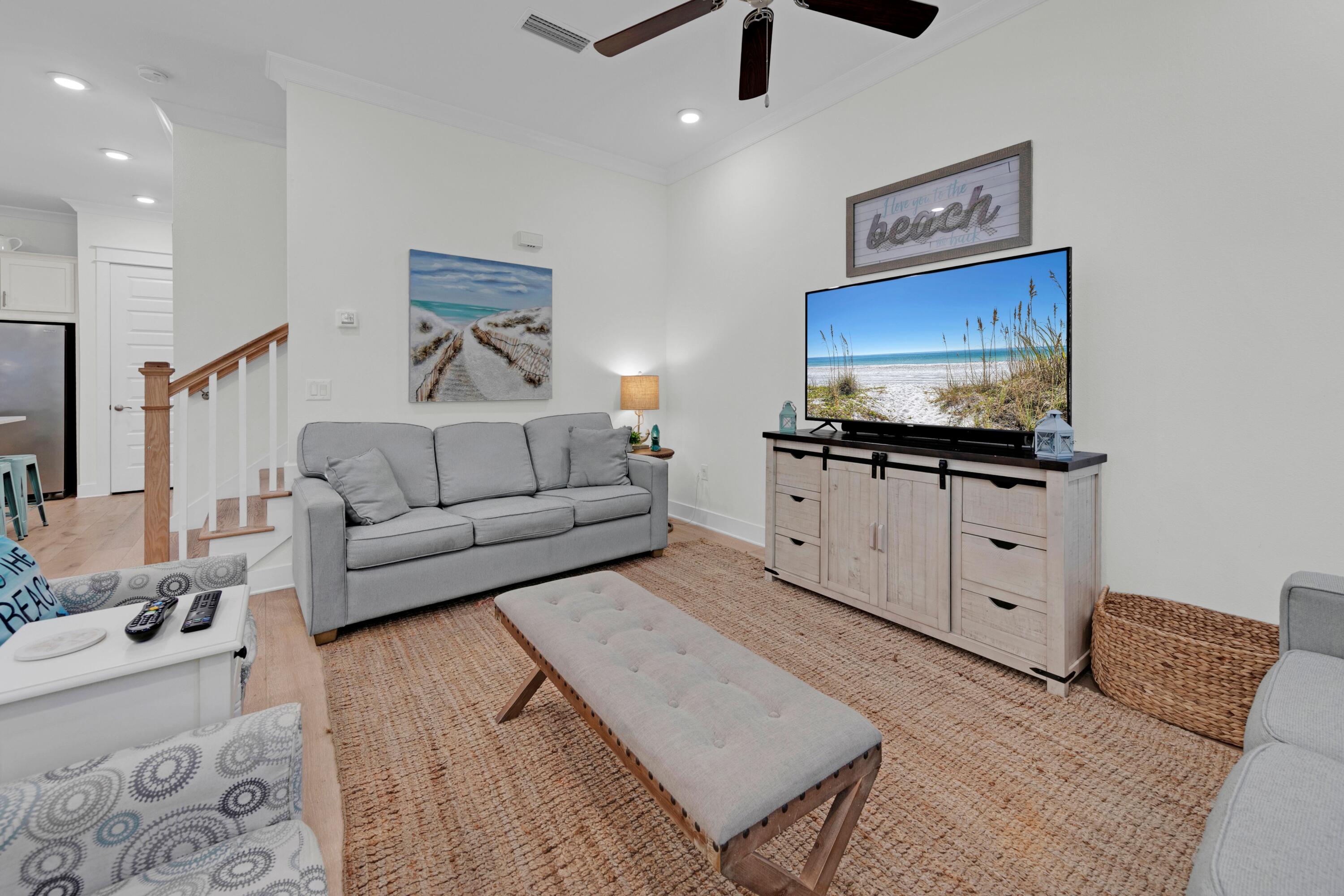 209 Milestone Dr Inlet Beach, Unit B Inlet Beach, FL 32461 - Photo 5 of 39 a living room with furniture and a flat screen tv