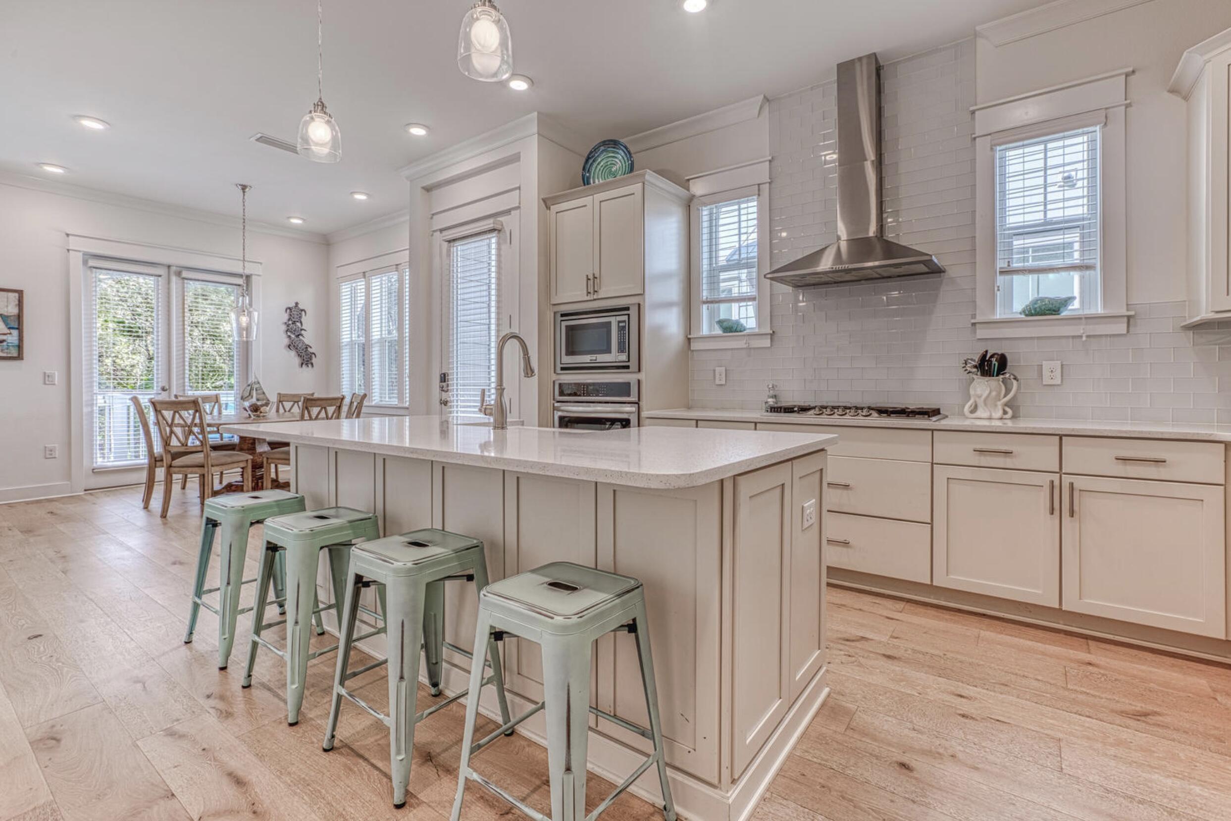 209 Milestone Dr Inlet Beach, Unit B Inlet Beach, FL 32461 - Photo 6 of 39 a kitchen with cabinets appliances and a center island