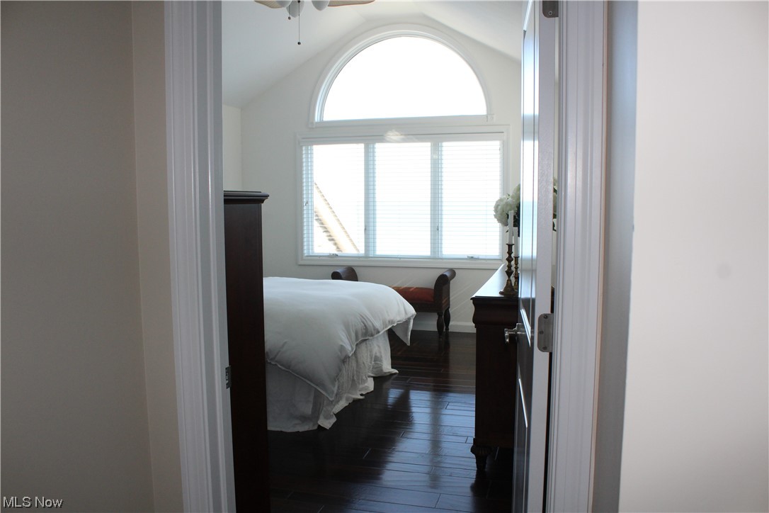 122 Turtle Bay Huron, OH 44839 - Photo 31 of 31 Bedroom featuring vaulted ceiling, dark hardwood floors, and ceiling fan