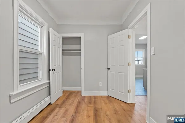a view of wooden floor in an empty room