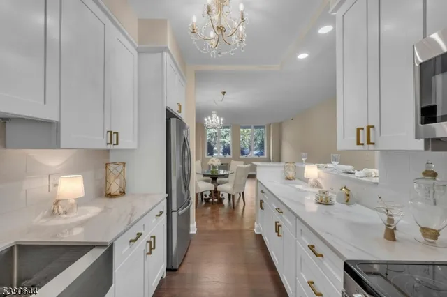 a kitchen with a sink and a potted plant