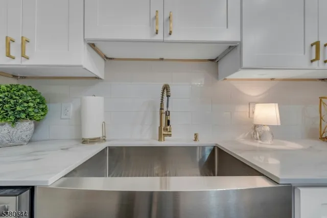 a kitchen with a stove and cabinets