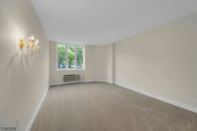 a view of an empty room and window